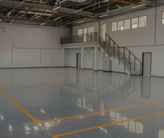 Epoxy flooring in car service space.