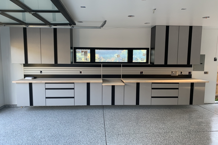 floating and wall-mounted light grey garage cabinet system.
