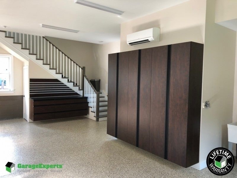 New hard flooring with stairs and some cabinets.