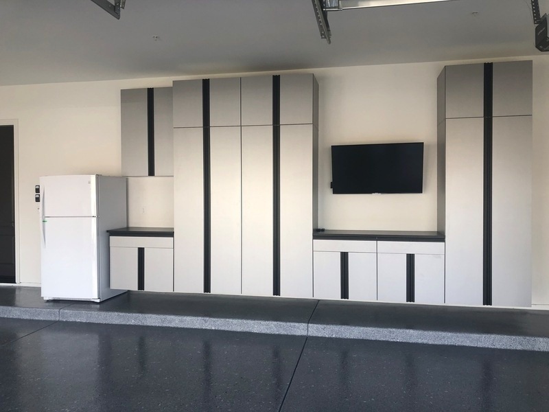 White and black cabinets newly installed in a garage