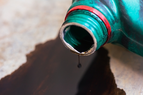 Oil spilling on the concrete floor.